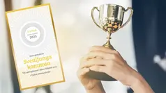 Händer håller upp en pokal bredvid diplom för andra plats i Bästa Tillväxt 2025.