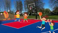 Bild på vår streetbasketplan. På förgrunden syns grafik på spelande barn och en hejande korvmedbröd-gubbe.